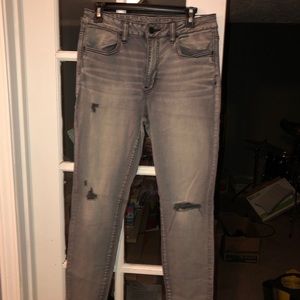 grey jeans distressed with small rips turned black